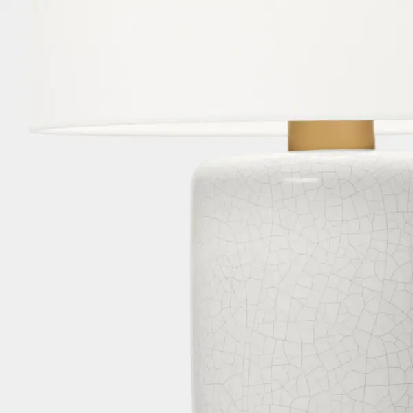 Barbara Barry's Shanghai Table Lamp combines a sleek cylindrical ceramic base with a tailored linen shade for understated elegance. The white crackle finish adds subtle texture while maintaining versatility across modern and transitional interiors. - alternate view