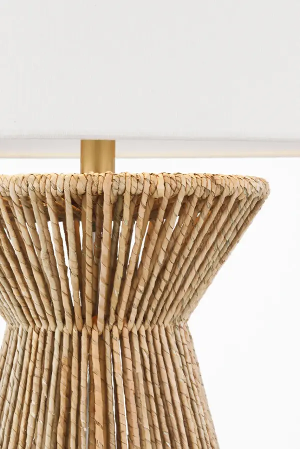 The Antigua table lamp showcases natural abaca woven into a textured base, topped with a classic linen shade. At 29" tall, it delivers substantial presence while maintaining versatility across coastal, transitional, and organic modern interiors. - alternate view