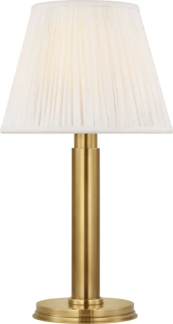 The Connie cordless accent lamp combines classic elegance with modern convenience. Its antique-burnished brass finish and silk pleated shade create sophisticated ambiance anywhere without cord constraints.