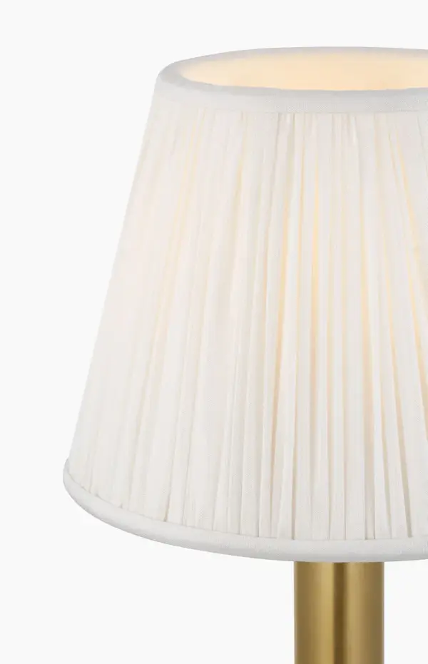 The Connie cordless accent lamp combines classic elegance with modern convenience. Its antique-burnished brass finish and silk pleated shade create sophisticated ambiance anywhere without cord constraints. - alternate view