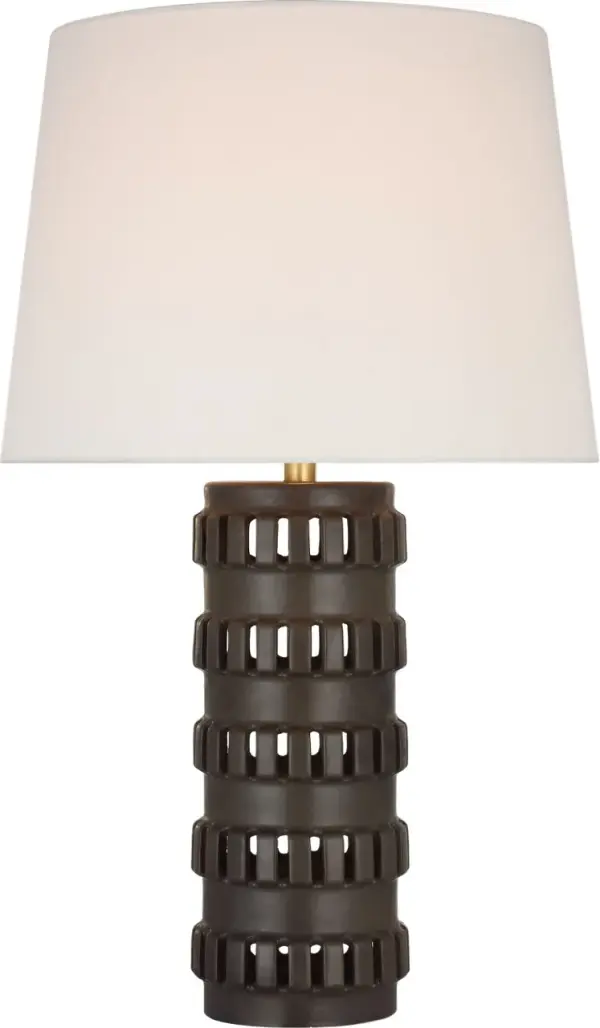 The Mullin table lamp combines organic warmth with refined design through its dusted cocoa wood finish and classic linen shade. At 31 inches tall, it provides substantial presence while maintaining versatility across traditional and contemporary interiors.