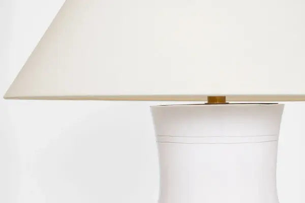 The Sorrento table lamp combines a distinctive glossy white crackle ceramic base with a classic linen shade, creating a refined transitional piece that bridges traditional and contemporary aesthetics with coastal charm. - alternate view