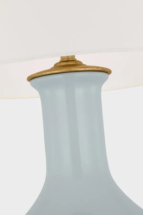 The Lambay cordless table lamp combines sophisticated style with modern portability. Its ice blue ceramic base and linen shade create a serene, coastal aesthetic while rechargeable technology eliminates cord clutter. - alternate view