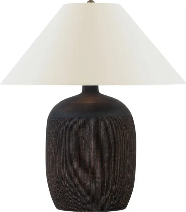 The Portis 32" table lamp showcases handcrafted terracotta with a distinctive combed texture and black wash finish. Its substantial 32" height makes a bold statement while the natural linen shade softens the light beautifully.