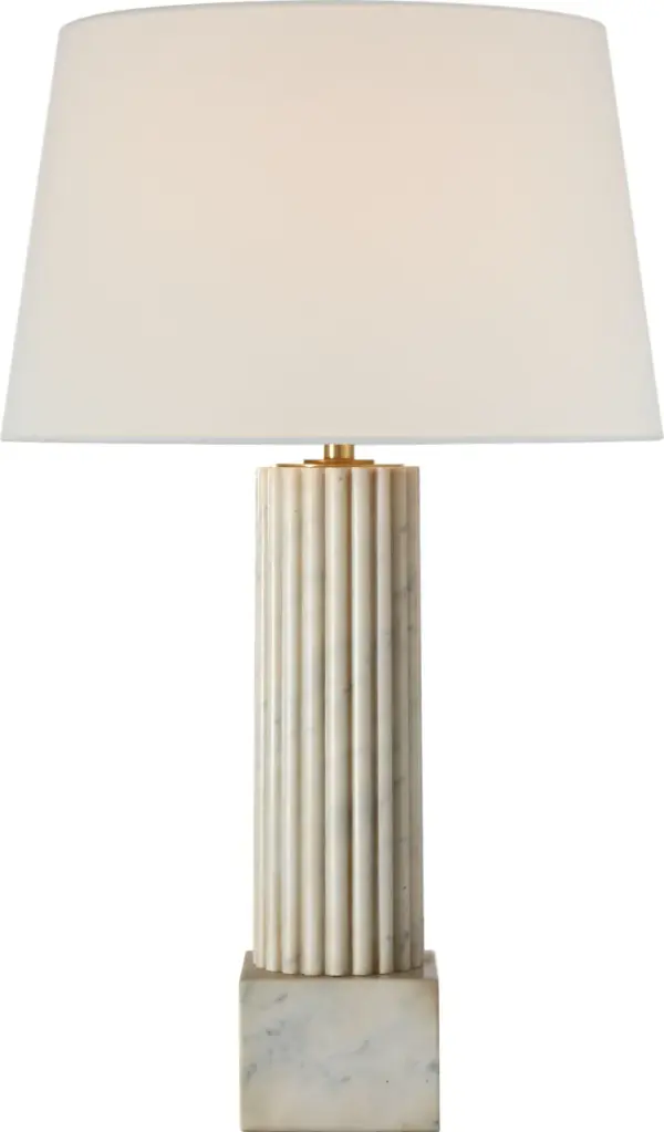 The Reeve table lamp combines natural Carrara marble with a classic linen shade for sophisticated lighting. At 29" tall, it provides substantial presence while maintaining refined proportions for versatile placement.