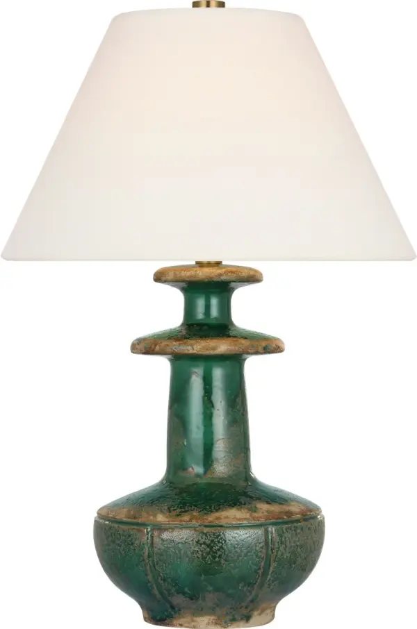 The Temara table lamp brings refined coastal elegance with its distinctive Corsican Green ceramic base and classic linen shade. At 28" tall, it provides substantial presence while maintaining versatility across traditional and transitional interiors.