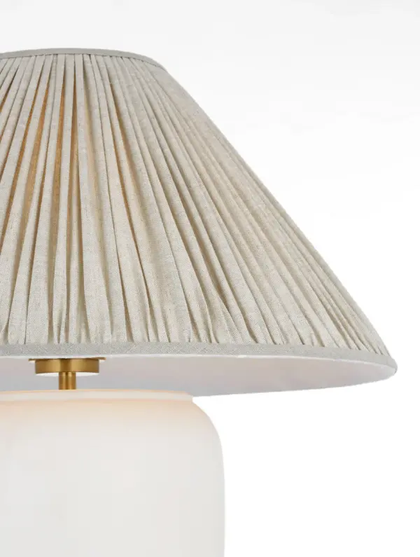 The Anwen cordless table lamp combines sophisticated design with modern convenience. Its portable, rechargeable design eliminates cord clutter while the pleated linen shade and Chantilly finish create a refined aesthetic. - alternate view