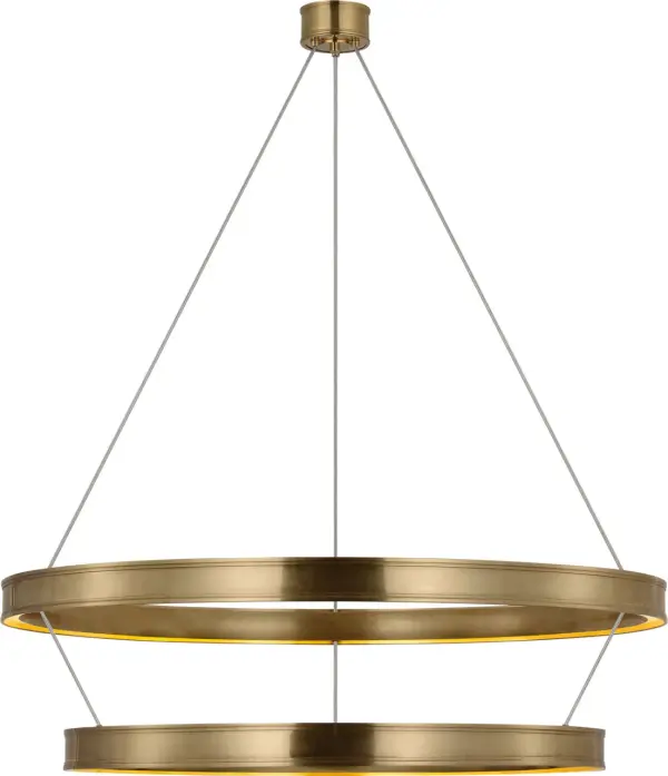 The Connery 50" chandelier commands attention with its dramatic two-tier ring construction and warm antique-burnished brass finish. This oversized fixture brings architectural sophistication to grand spaces. - alternate view