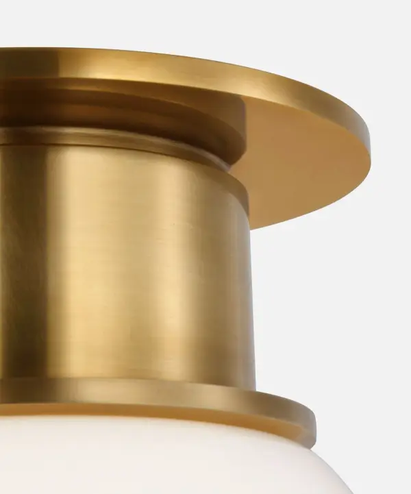 The Callan 9" Flush Mount combines classic antique-burnished brass with a clean white glass globe, delivering sophisticated lighting in a compact profile perfect for smaller spaces and low ceilings. - alternate view