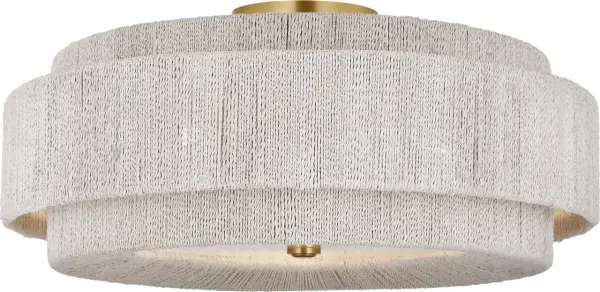 The Dorado 25" flush mount combines warm antique brass with natural woven abaca for a sophisticated coastal aesthetic. Its generous 25-inch diameter makes a bold statement while maintaining a low profile perfect for standard ceiling heights.