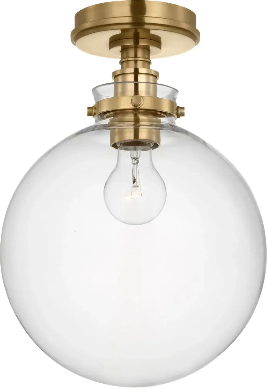Parkington 10" Globe Flush Mount in Antique-Burnished Brass with Clear Glass - Image 1