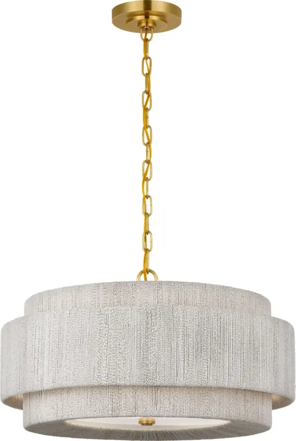 The Dorado chandelier combines antique-burnished brass with woven abaca for a sophisticated coastal aesthetic. At 24 inches, it offers substantial presence while maintaining versatility across dining and living spaces.