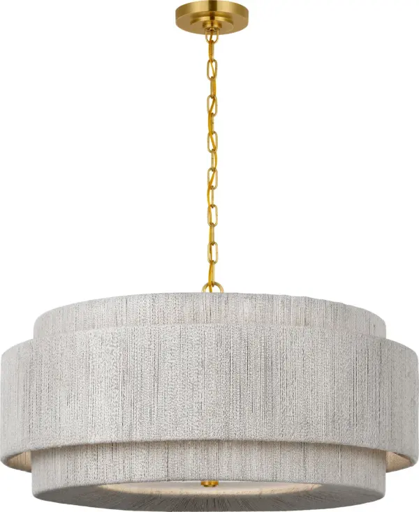 The Dorado chandelier masterfully blends warm antique brass with handcrafted washed abaca weaving, creating a statement piece that brings organic texture and refined coastal charm to any space.