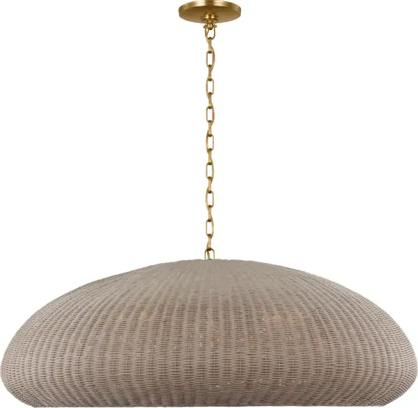 The Kokomo 44" pendant combines warm antique brass with handwoven ash wicker for a sophisticated organic aesthetic. Its generous scale makes it perfect for anchoring large dining spaces or open-concept areas with natural texture and ambient light.