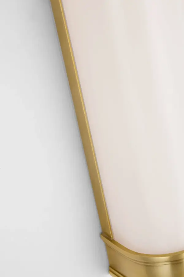 The Marden 24" Salon Bath Sconce delivers sophisticated bathroom lighting with its antique-burnished brass finish and clean white glass shades. Perfect for vanity lighting, this fixture combines traditional warmth with contemporary lines. - alternate view