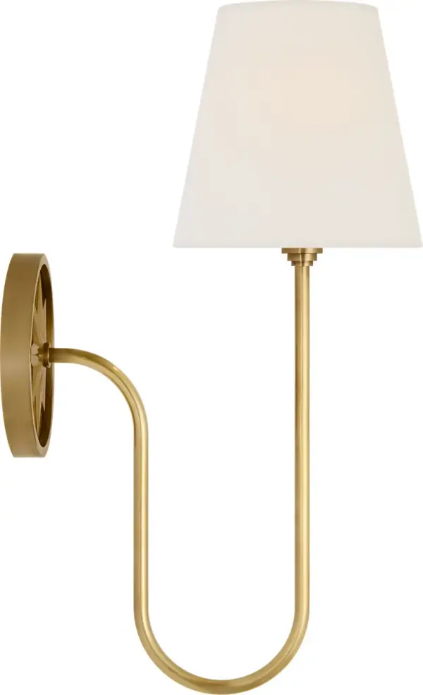 The Polaris 17" sconce combines antique-burnished brass with a classic linen shade for sophisticated ambient lighting. Its generous size and transitional design make it versatile for both traditional and contemporary interiors.