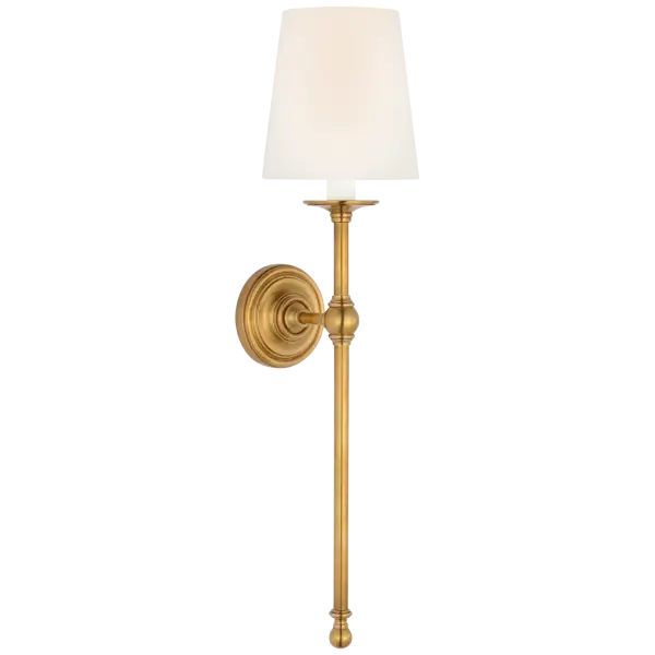 This 27-inch tail sconce combines classic design with refined materials. The antique-burnished brass finish adds warmth and sophistication, while the linen shade provides soft, diffused lighting perfect for bedrooms and living spaces. - alternate view