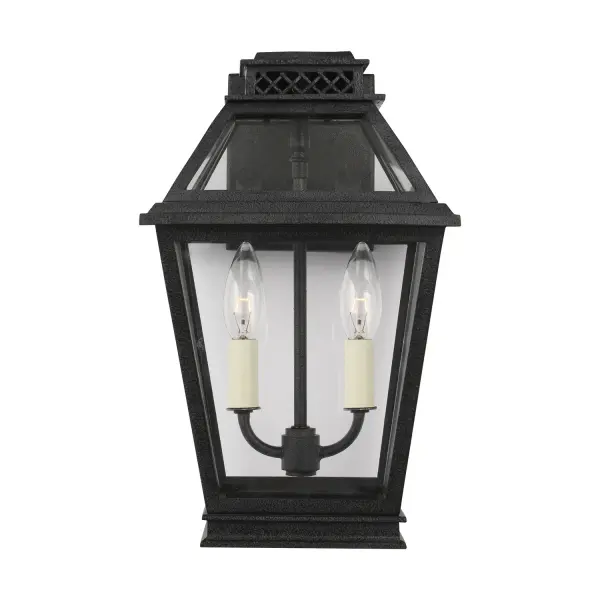The Falmouth outdoor wall lantern by Chapman & Myers brings vintage charm to modern exteriors. Its clean-lined tapered box frame and clear glass panels create an elegant, uncluttered look that works beautifully on porches, patios, and entryways.