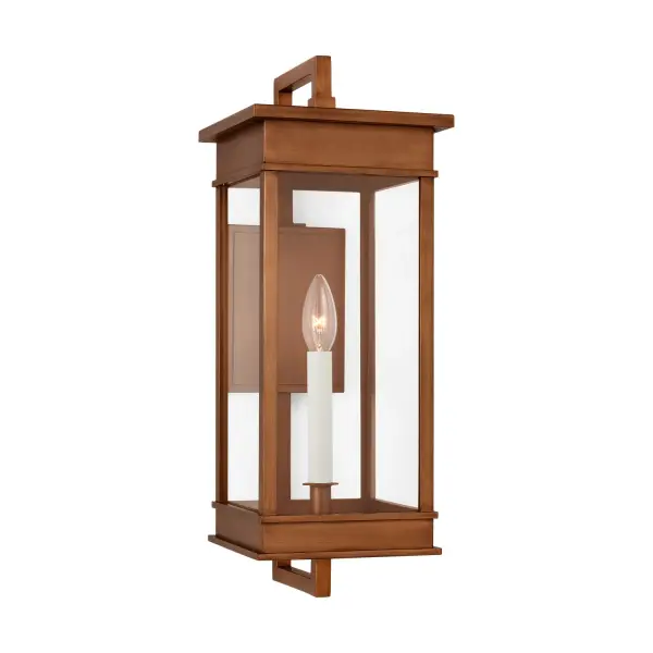 The Cupertino wall lantern by Chapman & Myers brings transitional elegance to outdoor spaces with its rectangular profile and natural copper finish. Features traditional candelabra styling with cream candle tubes and architectural stepped detailing.