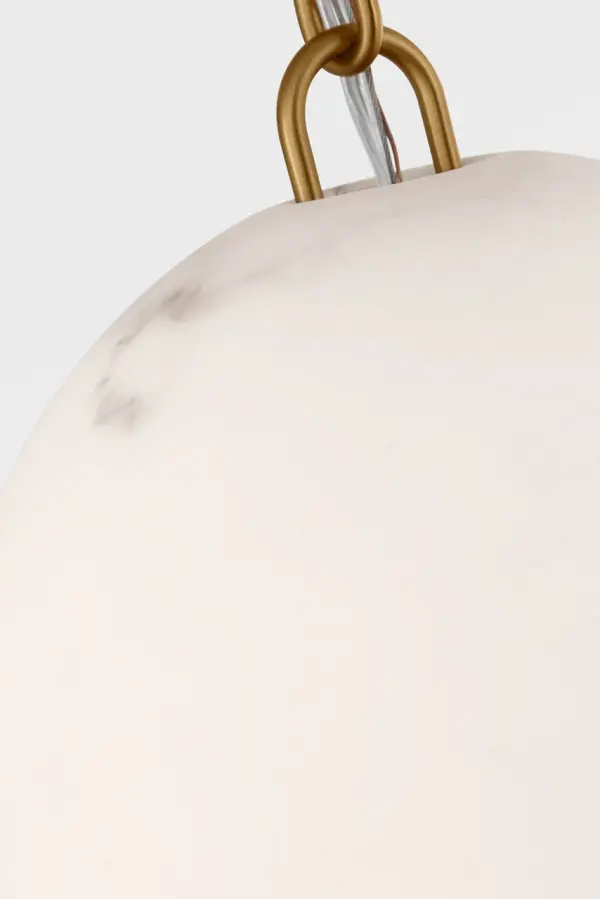 The Savina 10" Pendant combines understated elegance with artisanal craftsmanship. Its hand-crafted mineral opaline shade mimics natural alabaster veining, creating soft ambient lighting perfect for intimate spaces. - alternate view