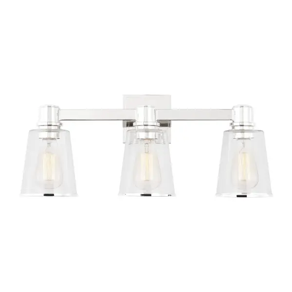 Chapman & Myers' Alessa collection delivers sophisticated simplicity with rectangular metal arms and tapered clear glass shades that showcase vintage-style bulbs. The polished nickel finish adds refined elegance to any bathroom.