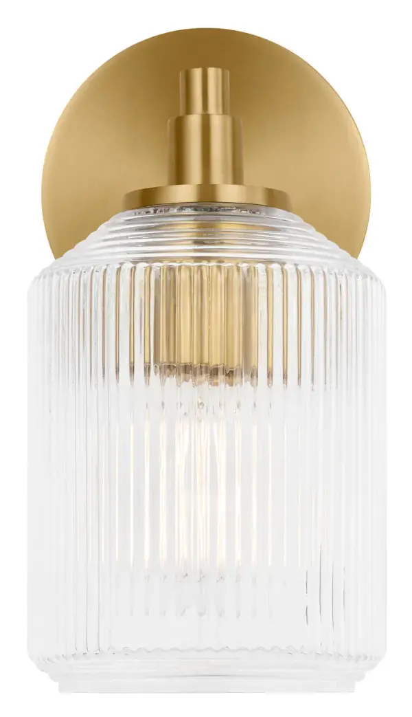 The Barstow 9" vanity light combines vintage prismatic glass craftsmanship with modern minimalism. Its ribbed clear shade and refined metal frame deliver architectural sophistication in a compact form, perfect for smaller vanities or paired installations. - alternate view