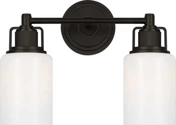 The Ashford 14" vanity light combines architectural clarity with industrial detailing through its knurled accents and square arch bracket. Perfect for single vanities and guest baths, it delivers sophisticated style in a compact profile.