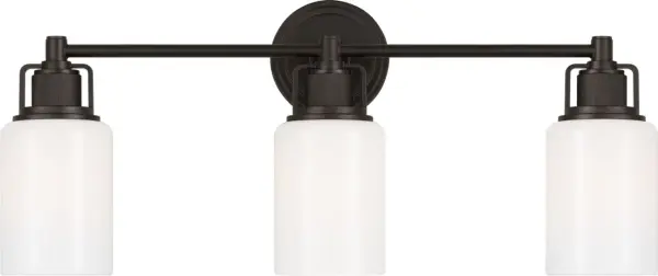 The Ashford 24" Bath combines industrial precision with refined simplicity through its square arch bracket, circular collars, and dual white cylindrical glass shades. Vertically knurled socket covers echo popular bath fittings.