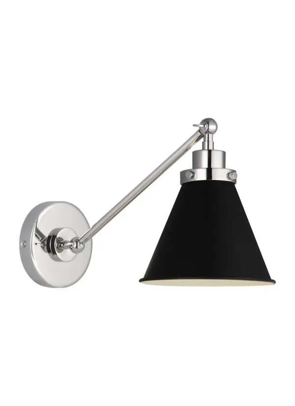 The Wellfleet sconce by Chapman & Myers blends industrial utility with refined details. Its midnight black dome shade and polished nickel hardware create striking contrast, while the compact profile works in tight spaces.