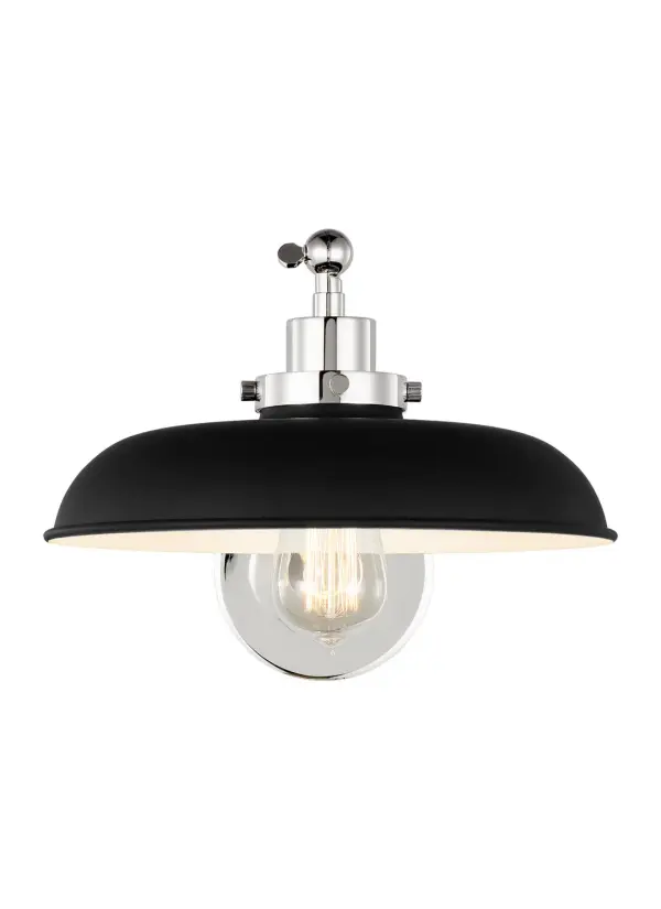 The Wellfleet sconce blends factory lighting heritage with modern refinement. Its midnight black dome shade and polished nickel hardware create striking contrast, while the 17.75-inch extension provides excellent task lighting.