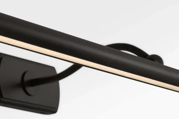 The Lamont 24" Picture Light combines minimal form with purposeful function, featuring an ultra-slim LED shade that delivers even illumination across medium-sized artwork. Its sculptural S-shaped arm and refined detailing create an elevated atmosphere. - alternate view