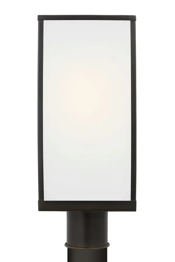 The Howell Medium Post Lantern combines timeless design with modern sensibility. Its clean rectangular frame and clear glass panels showcase a warm filament bulb, while the Antique Bronze finish adds sophistication to pathways and entryways.