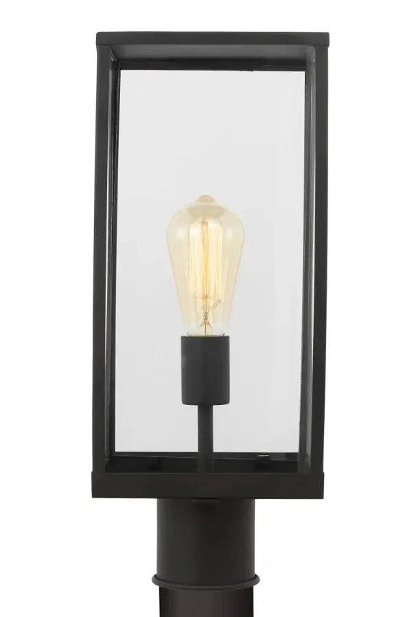The Howell Post Lantern blends traditional lantern charm with modern simplicity. Its rectangular frame and clear glass panels showcase filament bulbs beautifully, while the wet-rated construction ensures durability in any weather.
