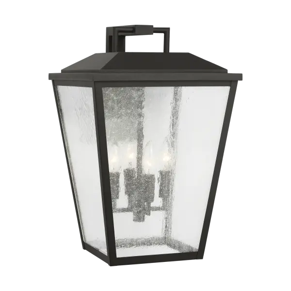 The Kennewick XL Wall Lantern makes a dramatic statement with its oversized proportions and textured black finish. Perfect for large outdoor spaces, this transitional design combines farmhouse charm with coastal elegance.