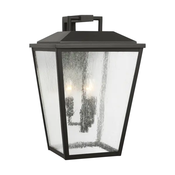 The Kennewick Large Wall Lantern combines traditional lantern styling with a modern textured black finish. Its substantial size makes a strong architectural statement on exterior walls while providing ample illumination.