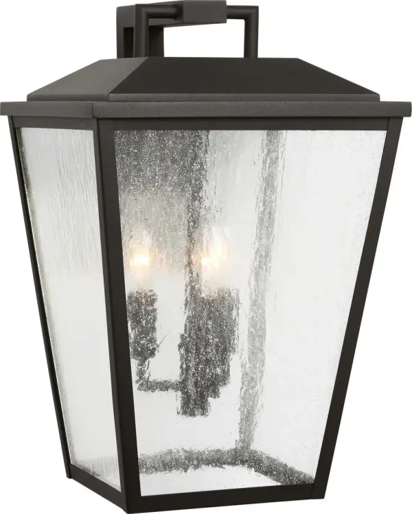 The Kennewick Large Wall Lantern combines traditional lantern styling with a modern textured black finish. Its substantial size makes a strong architectural statement on exterior walls while providing ample illumination. - alternate view