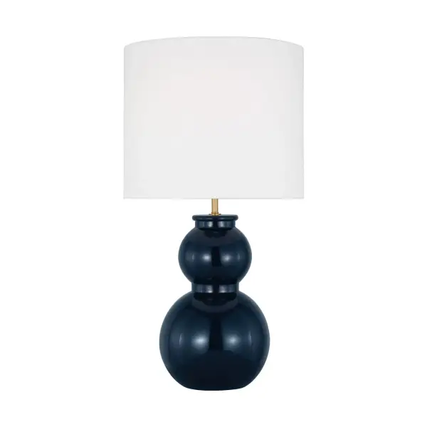 Drew & Jonathan Scott's Buckley reimagines the classic gourd silhouette with saturated color and clean lines. The glossy navy glass body paired with a crisp white linen shade creates sophisticated contrast for transitional interiors.
