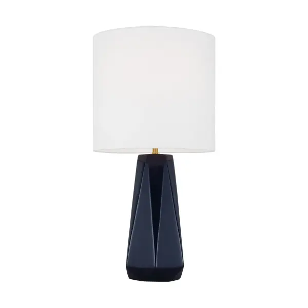 The Moresby table lamp balances traditional form with contemporary color, featuring a glossy navy glass base and crisp white cotton shade. Its compact 12-inch footprint and 23-inch height make it ideal for bedside tables and desks.