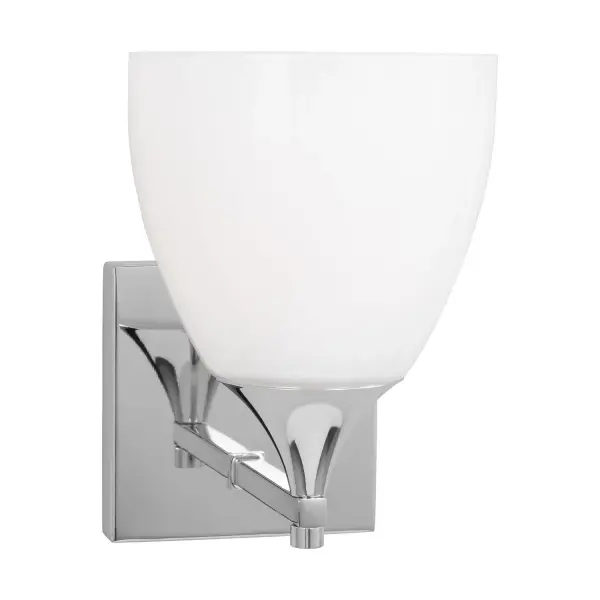 The Toffino sconce blends classic form with contemporary finishes, featuring a milk glass shade and chrome finish. Its reversible mounting and damp location rating make it ideal for bathrooms and hallways.