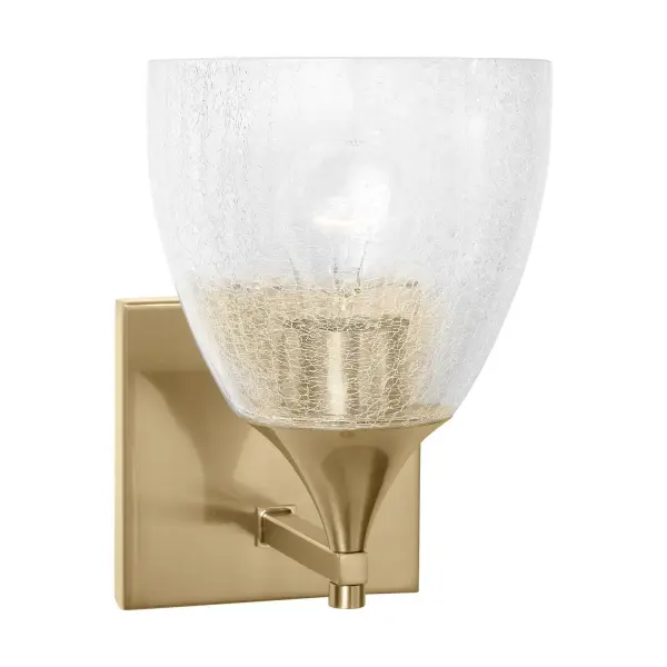 The Toffino wall sconce blends traditional form with modern finishes, featuring distinctive crackle glass and warm satin brass. Its reversible mounting and damp location rating make it ideal for bathrooms and hallways.
