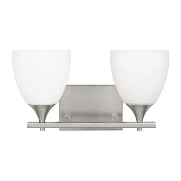 The Toffino brings fresh sophistication to bathroom lighting with its milk glass shades and clean-lined silhouette. Reversible mounting and damp location rating make it adaptable for various spaces.