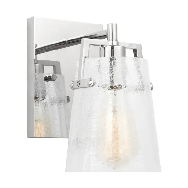 The Crofton wall sconce combines sleek chrome finish with distinctive crackle glass for a contemporary look that works across multiple design styles. Its compact size and reversible mounting make it ideal for bathrooms and hallways.