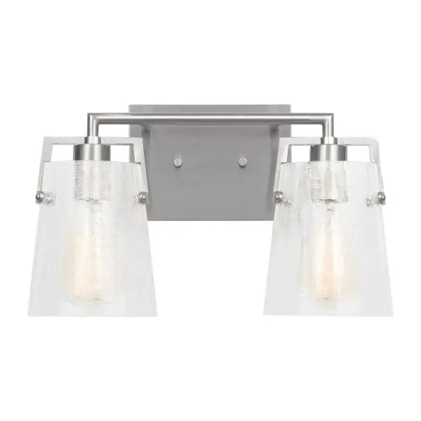 The Crofton vanity light by Drew & Jonathan Scott delivers clean, functional lighting with a touch of texture. Its crackle glass shade and reversible mounting make it adaptable to various bathroom styles and configurations.