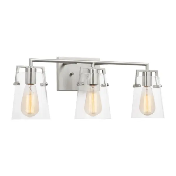 Drew & Jonathan's Crofton sconce delivers clean, functional lighting with transitional appeal. The 24-inch width suits most vanities, while clear glass shades showcase filament bulbs beautifully. Reversible mounting and damp rating add flexibility.
