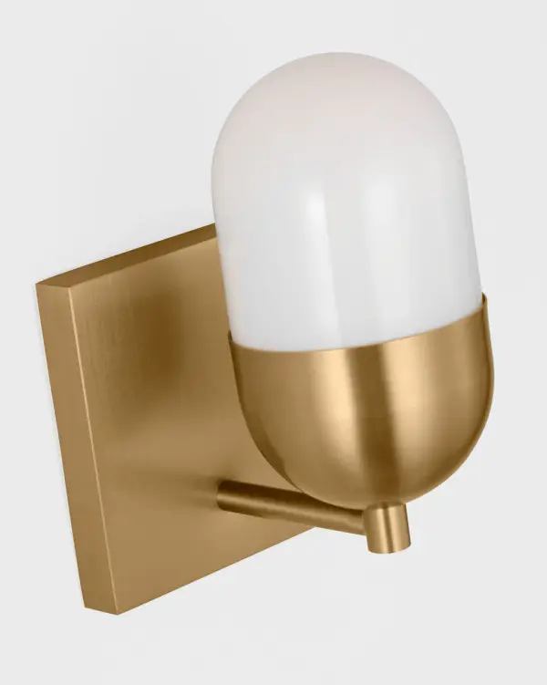 The Foster Small Vanity combines minimalist elegance with functional design. Its milk glass shade provides gentle ambient uplighting while the satin brass finish adds warmth to contemporary bathrooms. - alternate view