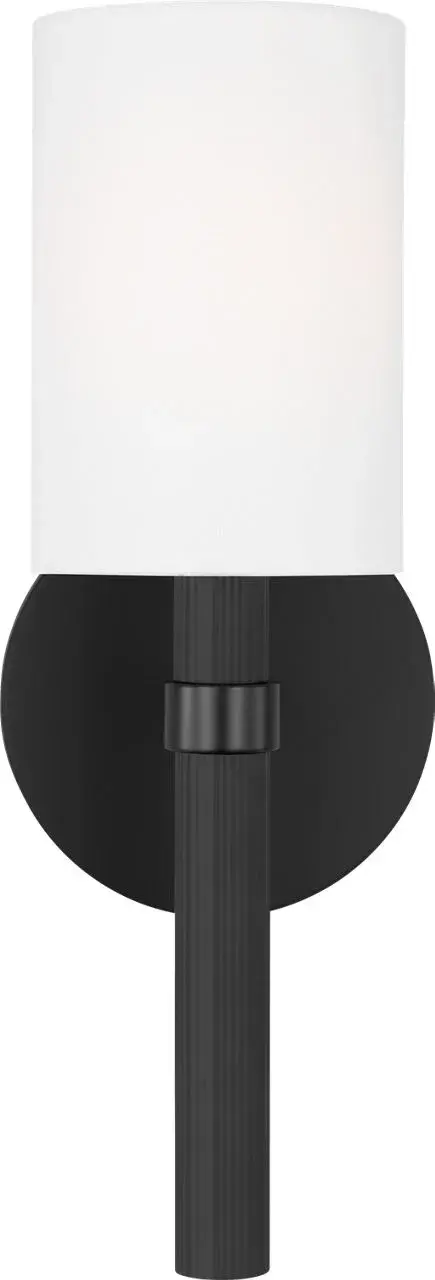 The Manor Small Sconce combines modern minimalism with classic elegance through its textured body and clean lines. The white linen shade provides soft, inviting illumination perfect for intimate spaces.