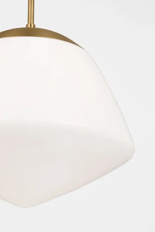 The Milne Small Pendant reimagines classic schoolhouse lighting with angular milk glass and minimalist brass detailing. Its warm, diffused glow and damp-rating make it perfect for kitchens, entryways, and dining spaces seeking understated sophistication. - alternate view