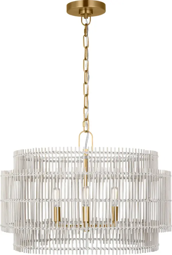 The Elio Medium Hanging Shade masterfully combines striated bamboo with burnished brass metalwork, creating captivating light patterns. Its damp-rated design and versatile aesthetic work beautifully in both modern and bohemian spaces.