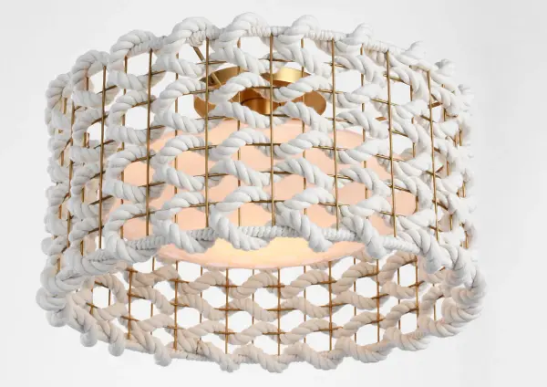 The Catania flush mount combines warm antique brass with handcrafted cream woven rope for a sophisticated coastal aesthetic. Its 17-inch diameter provides ample illumination while the low-profile design suits standard ceiling heights. - alternate view