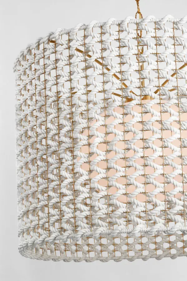 The Catania 40" pendant makes a bold statement with its generous scale and handcrafted woven rope shade. The antique-burnished brass finish adds warmth while the natural texture brings organic coastal charm to any space. - alternate view